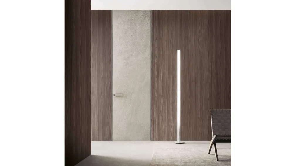 Porta a filo muro per interni Moon in finitura gres crema con struttura in alluminio finitura Platino di Rimadesio